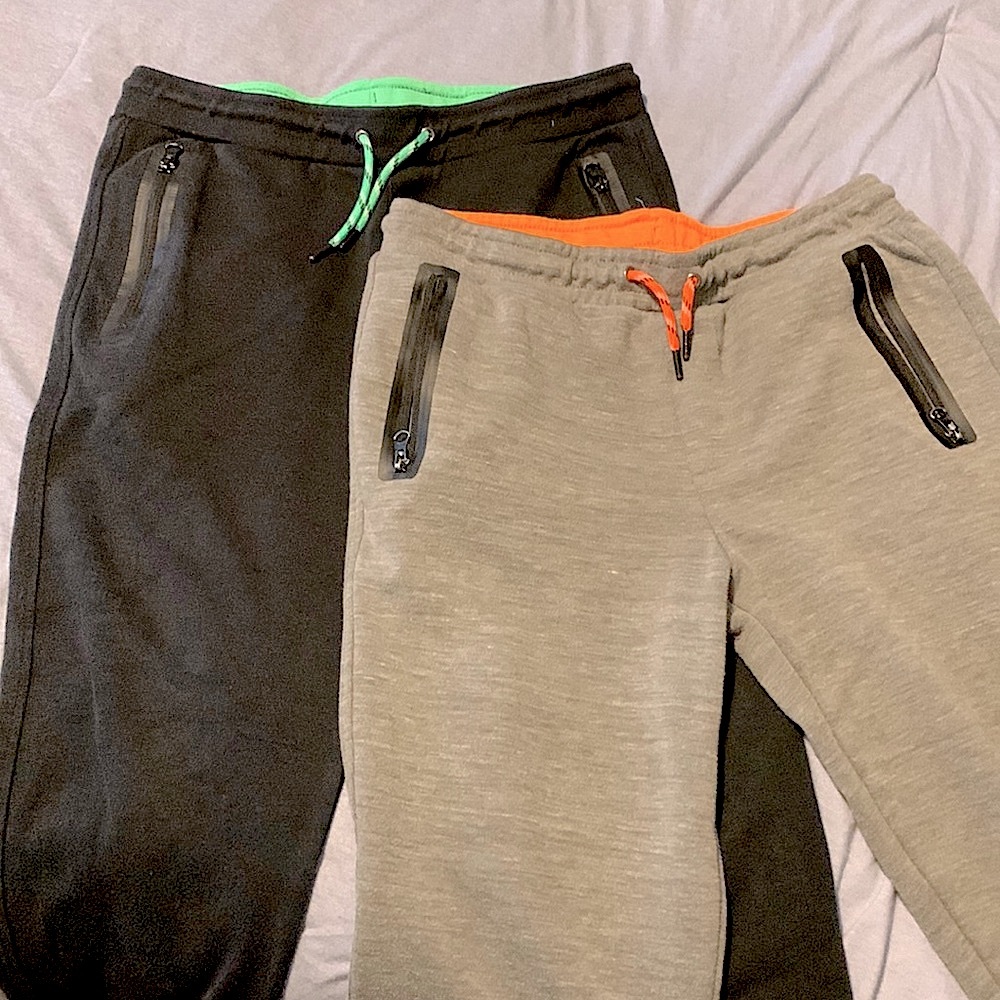 Two athlete pants with cuffed ankles